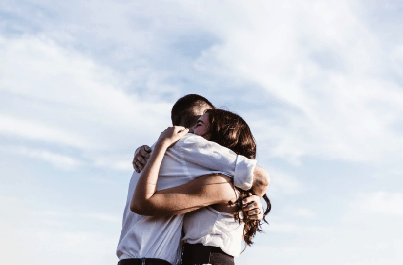 Couple Hugging And Kissing In